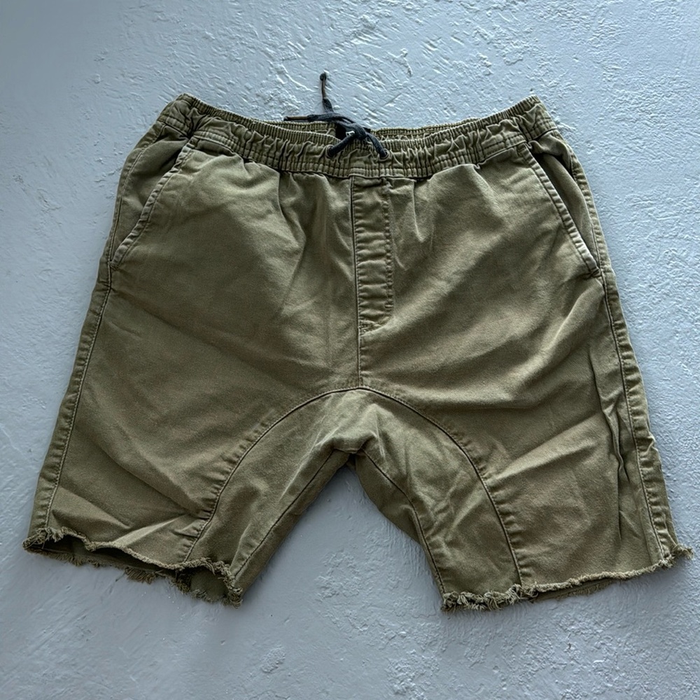 Green drop crotch distressed shorts
